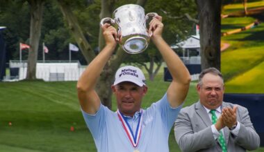 Padraig Harrington lifts up the Francis D. Ouimet Memorial Trophy after winning the U.S. Senior Open at Scioto Country Club