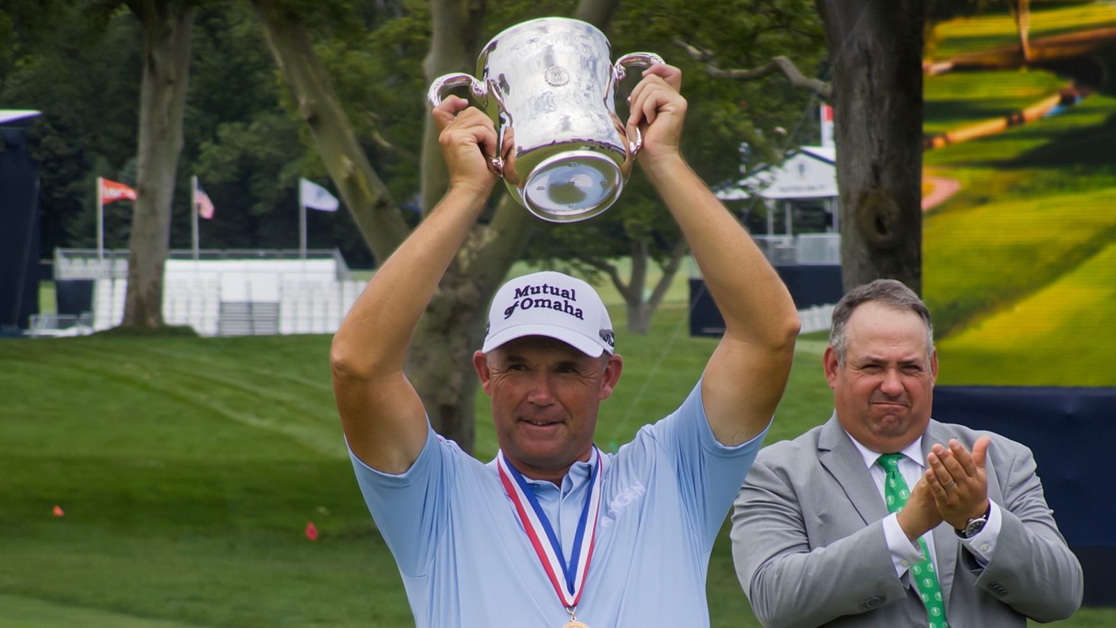 Padraig Harrington lifts up the Francis D. Ouimet Memorial Trophy after winning the U.S. Senior Open at Scioto Country Club