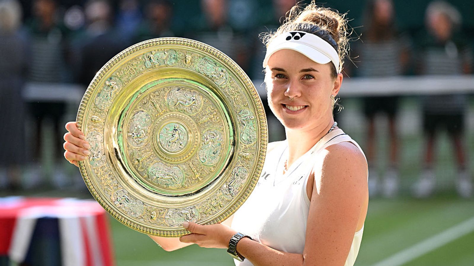 Czech Republic's Linda Noskova poses with the winner's trophy, the Venus Rosewater Dish, after winning against Czech Republic's Karolina Muchova during their women's singles final tennis match on the thirteenth day of the 2026 Wimbledon Championships at The All England Lawn Tennis and Croquet Club in Wimbledon, southwest London, on July 11, 2026. (Photo by Kirill KUDRYAVTSEV / AFP) / RESTRICTED TO EDITORIAL USE