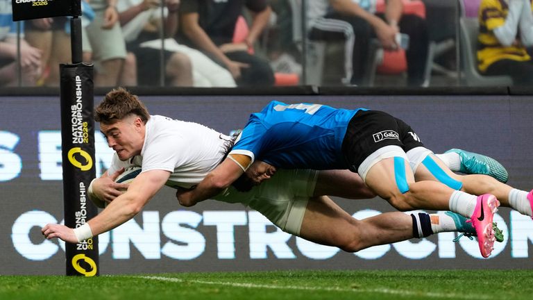 England's Tommy Freeman scores a try while being tackled by Argentina's Mateo Carreras during a Nations Championship rugby match in Santiago Del Estero, Argentina, Saturday, July 18, 2026. (AP Photo/Gustavo Garello)