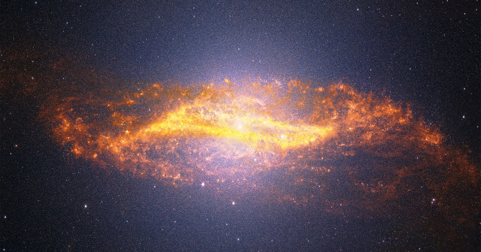 A bright, glowing spiral galaxy with fiery orange and yellow dust swirling around its center, set against a dark, star-filled space background.
