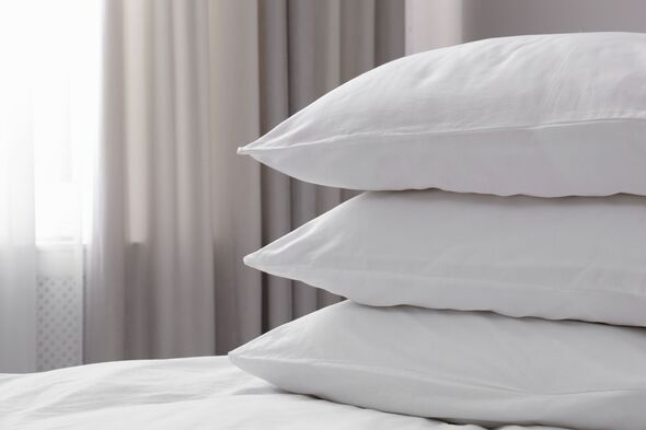 White soft pillows on bed. Space for text White soft pillows on bed. Space for text