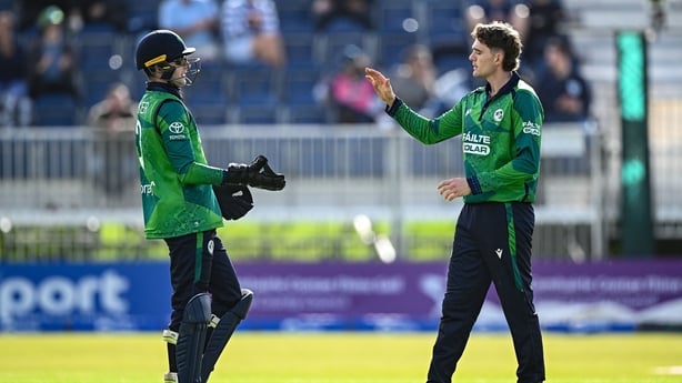 17 September 2025; Ireland bowler Gareth Delany, right, is congratulated by weeketkeeper Lorcan Tucker after taking the wicket of England batter Rehan Ahmed during match one of the T20 International Series between Ireland and England at Malahide Cricket Ground in Dublin. Photo by Seb Daly/Sportsfile