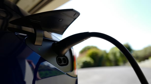 A TESLA model Y car sits inside a home garage whilst receiving a top up charge of solar powered electricity on October 03, 2023 in Ballina, Australia.