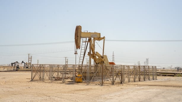 An oil pump jack,oil horse, oil jack, beam pump extracting crude oil from oil well in a desert in the Middle East