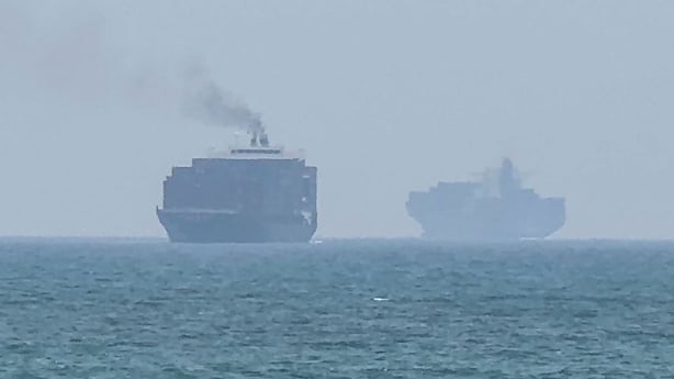 AFPTV video footage on July 12, 2026 shows cargo ships anchoring near the Strait of Hormuz off the eastern coast of the United Arab Emirates at Khor Fakkan.