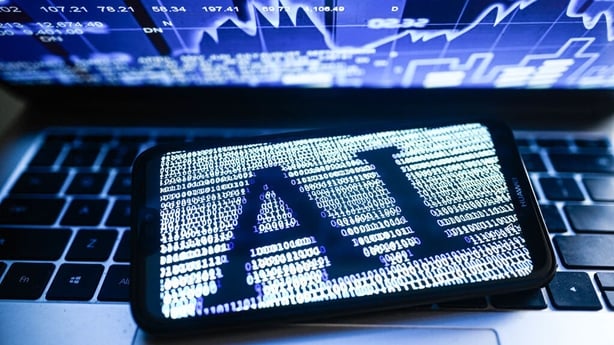 Illustration an Artificial Intelligence (AI) symbol is displayed on a smartphone