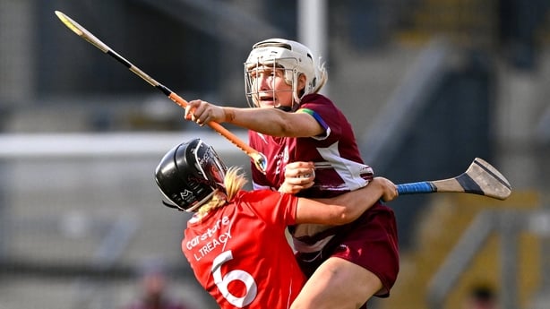 Shauna Healy of Galway is tackled by Laura Treacy of Cork during 2025 All-Ireland camogie player
