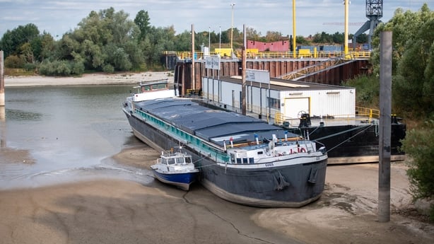TOLKAMER, NETHERLANDS - AUGUST 05: Ships lie on exposed sandbanks along the Rhine River on August 05, 2026 near Tolkamer, Netherlands. The Rhine River water level has reached record lows at measuring points along its route through neighbouring Germany due to ongoing drought and hot weather. The Rhin