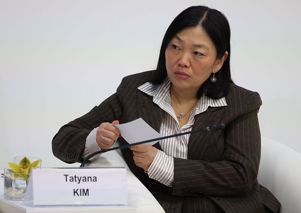 Tatyana Kim sitting down in front of a mic