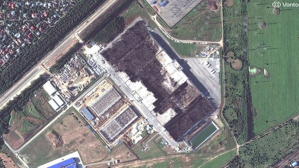 Satellite image shows extensive fire damage to a building