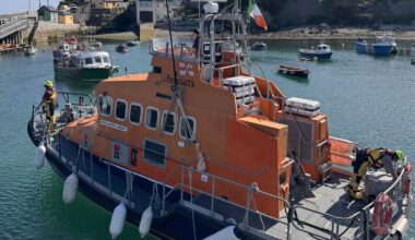 Four people rescued after fishing boat takes on water