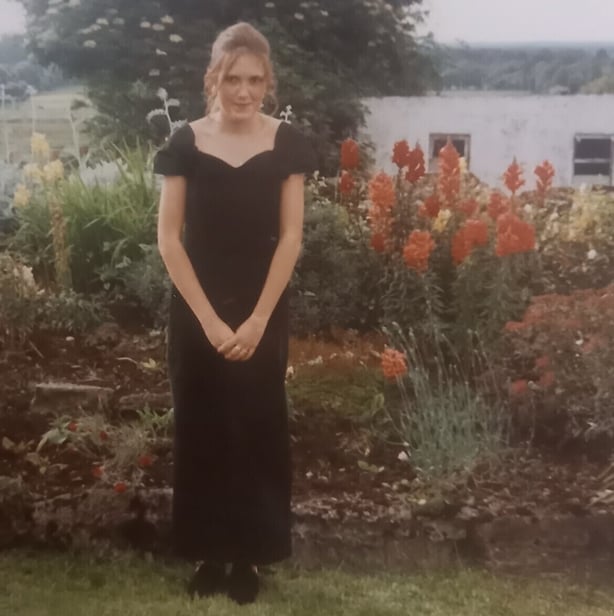 Sinead Nally, aged 16, poses for a photo in a garden