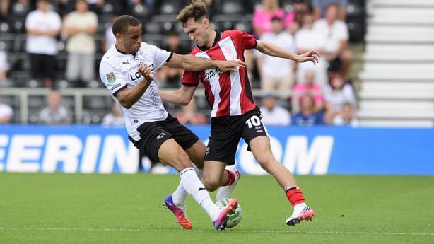 DERBY, ENGLAND - AUGUST 8: Mason Melia of Lincoln City under pressure from Carlton Morris of Derby County during the Carabao Cup first round match between Derby County and Lincoln City at Pride Park on August 8, 2026 in Derby, England. (Photo by Andrew Vaughan/Getty Images)