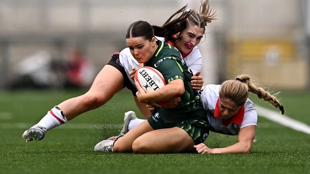 8 August 2026; Emily Foley of Connacht is tackled by Caitlin Crowe, left, and Katie Gilmour of Ulster during the Vodafone Womens Interprovincial Championship Round 1 match between Ulster and Connacht at Affidea Stadium in Belfast. Photo by Ben McShane/Sportsfile
