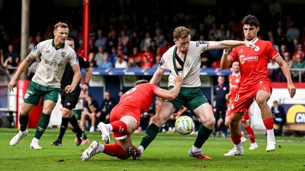 9 August 2026; Sean Hoare of St Patrick's Athletic is tackled by Odhrán Casey of Shelbourne during the SSE Airtricity Men's Premier Division match between Shelbourne and St Patrick's Athletic at Tolka Park in Dublin. Photo by Stephen McCarthy/Sportsfile