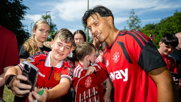 Lisandro Martinez of Manchester United greets fans after a training session at Carton Hotel