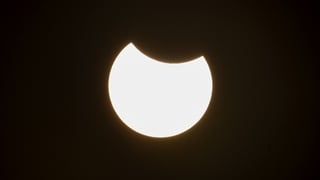 A picture taken in Ronda, South of Spain on March 29, 2025 shows the sun partially covered by the smaller dark disk of the moon during a partial solar eclipse. Skygazers across a broad swathe of the Northern Hemisphere have a chance to see the Moon take a