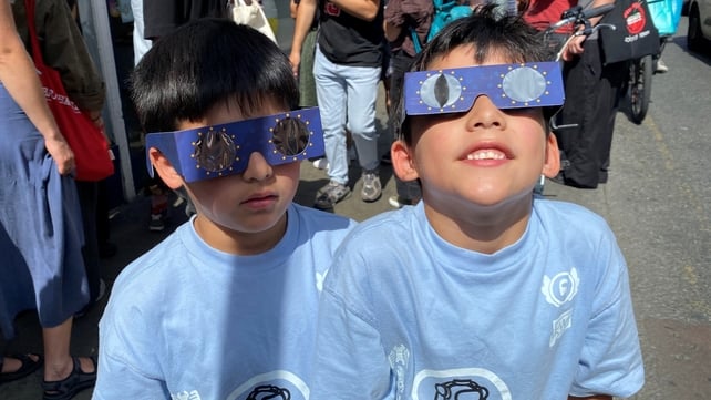 Seven-year-old twins Faron and Soren Walshe with their glasses in George's Street in Dublin