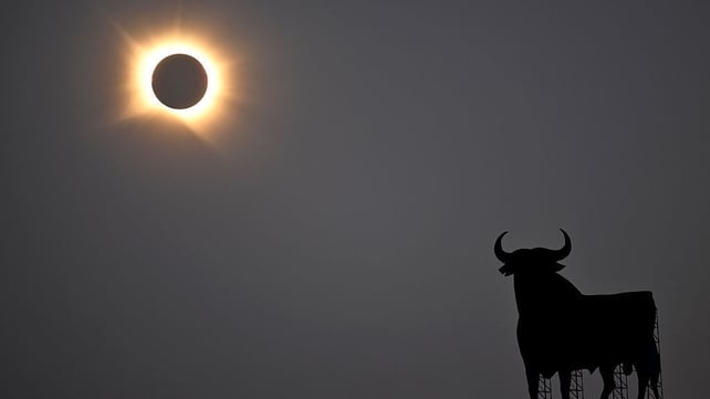 The Sun's corona glows as the Moon completely blocks the Sun during the totality phase of the total solar eclipse