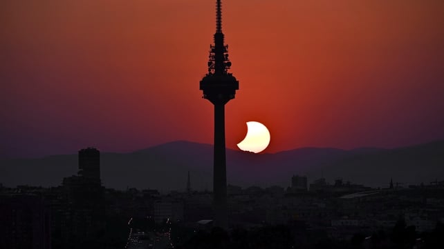 The Moon uncovers the Sun behind Torrespana TV tower, nicknamed "El Piruli", in the last moments of the solar eclipse as seen from the Cuna Verde viewpoint in Madrid