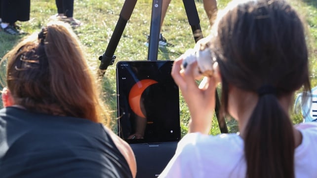 Technology is used to watch the partial solar eclipse in Dublin. Pic: Collins