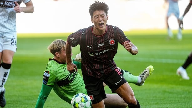 13 August 2026; Guesung Cho of Midtjylland is tackled by Bohemians goalkeeper Paul Girard-Walters during the UEFA Conference League Third Qualifying Round first leg match between Midtjylland and Bohemians at Arena Herning in Herning, Denmark. Photo by Lars Ronborg/Sportsfile