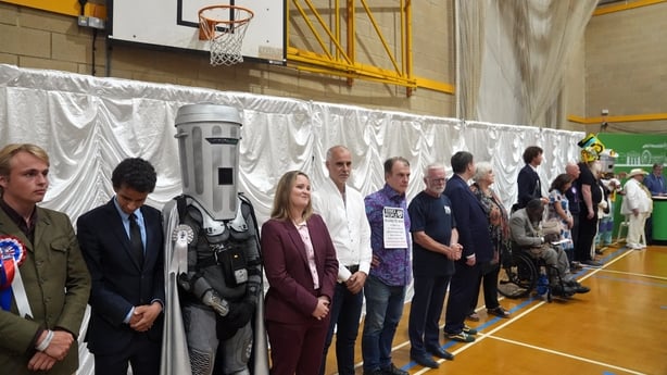 Candidates listen to the declaration for the Clacton by-election count 