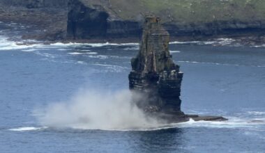 Section of Cliffs of Moher sea stack falls into Atlantic