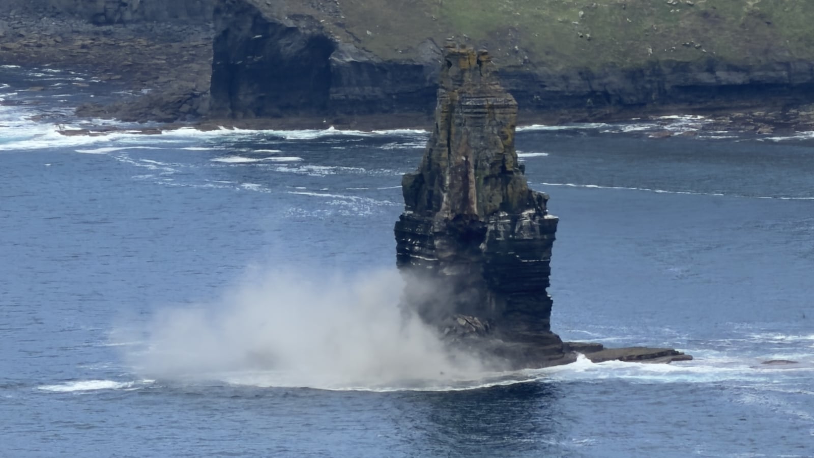 Section of Cliffs of Moher sea stack falls into Atlantic