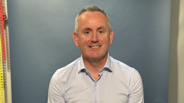 Man in a shirt smiling