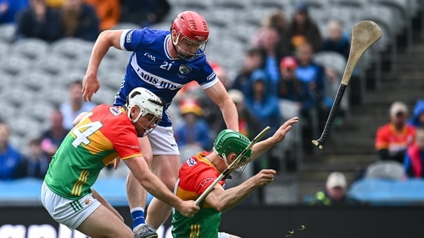 6 June 2026; Fionán Mahoney of Laois in action against Chris Nolan, left, and Jack McCullagh of Carlow during the Joe McDonagh Cup final match between Carlow and Laois at Croke Park in Dublin. Photo by Piaras Ó Mídheach/Sportsfile