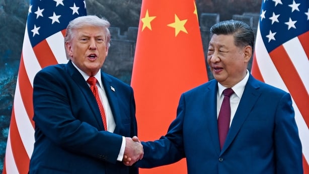 US President Donald Trump shakes hands with China's President Xi Jinping at the Great Hall of the People in Beijing