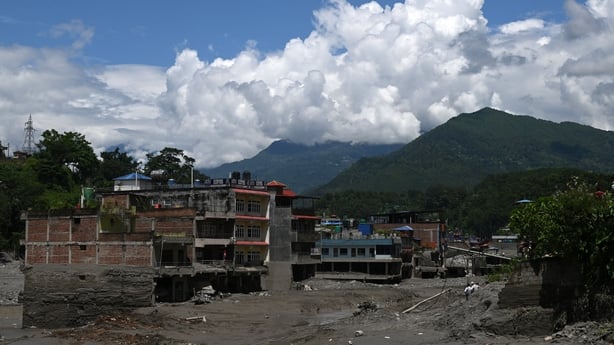 A general view shows houses lying deluged in sludge after flash floods