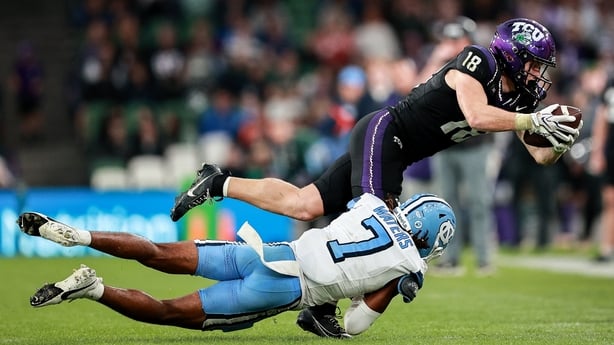 TCU wide receiver Ed Small #18 is tackled by North Carolina defensive back Peyton Waters #7 during the 2026 Aer Lingus College Football Classic match between TCU and North Carolina at the Aviva Stadium in Dublin