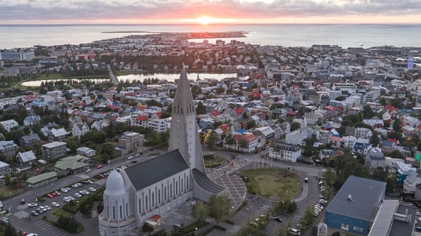 This aerial view taken on August 28, 2026, shows a panoramic view of Reykjavik, Iceland, with Hallgrimskirkja, Iceland's largest church, rising above the capital city's skyline. Icelanders will vote on August 29 on whether the country should resume EU accession negotiations, which were suspended in