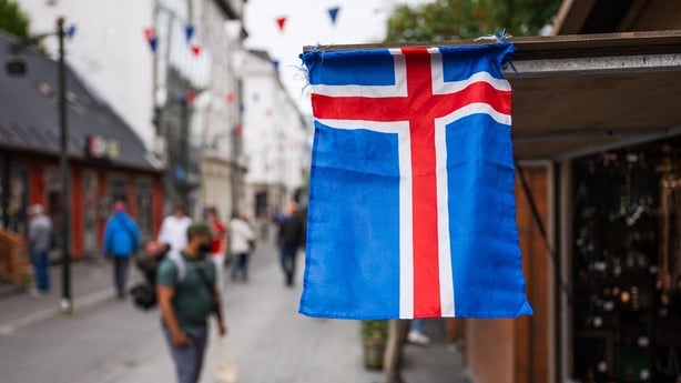 This image taken on August 25, 2026 shows an Icelandic flag displayed along a street in central Reykjavik, Iceland, ahead of the country's upcoming referendum. Icelanders are to vote August 29, 2026 on whether to resume entry talks with the European Union 13 years after they were suspended, in a ref