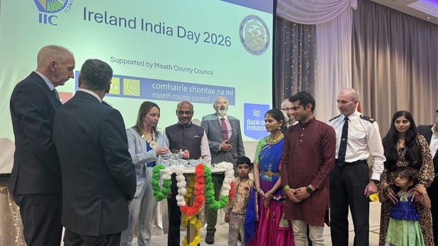 People stand on stage as part of the India Day event.