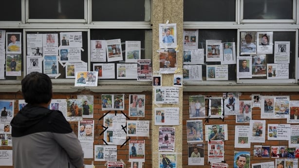 Families and relatives of those missing in the Tibet-Nepal flood check the name images of those missing at the Tribhuvan University Teaching Hospital in Kathmandu, Nepal, on August 30, 2026. A glacier outburst along the Tibet-Nepal border caused a sudden surge in the Bhotekoshi River flowing through