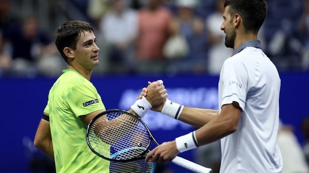 NEW YORK NEW YORK - AUGUST 30: Mariano Navone of Argentina embraces Novak Djokovic of Serbia after their Men's Singles First Round match on Day One of the 2026 US Open at USTA Billie Jean King National Tennis Center on August 30, 2026 in the Flushing neighborhood of the Queens borough of New York Ci