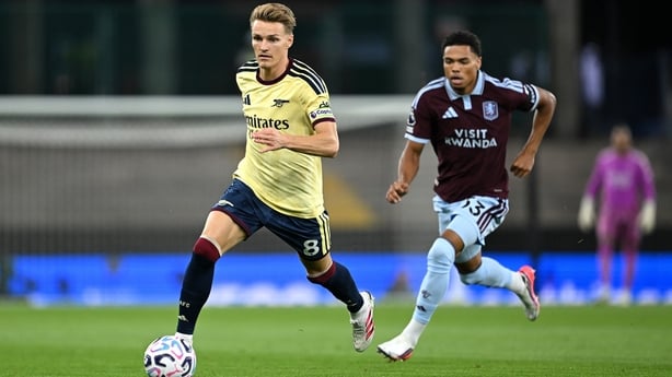 Martin Odegaard of Arsenal runs with the ball under pressure from George Hemmings of Aston Villa during the Premier League 2026/27 match between Aston Villa FC and Arsenal FC at Villa Park on August 31, 2026 in Birmingham, England. (Photo by David Price/Arsenal FC via Getty Images)