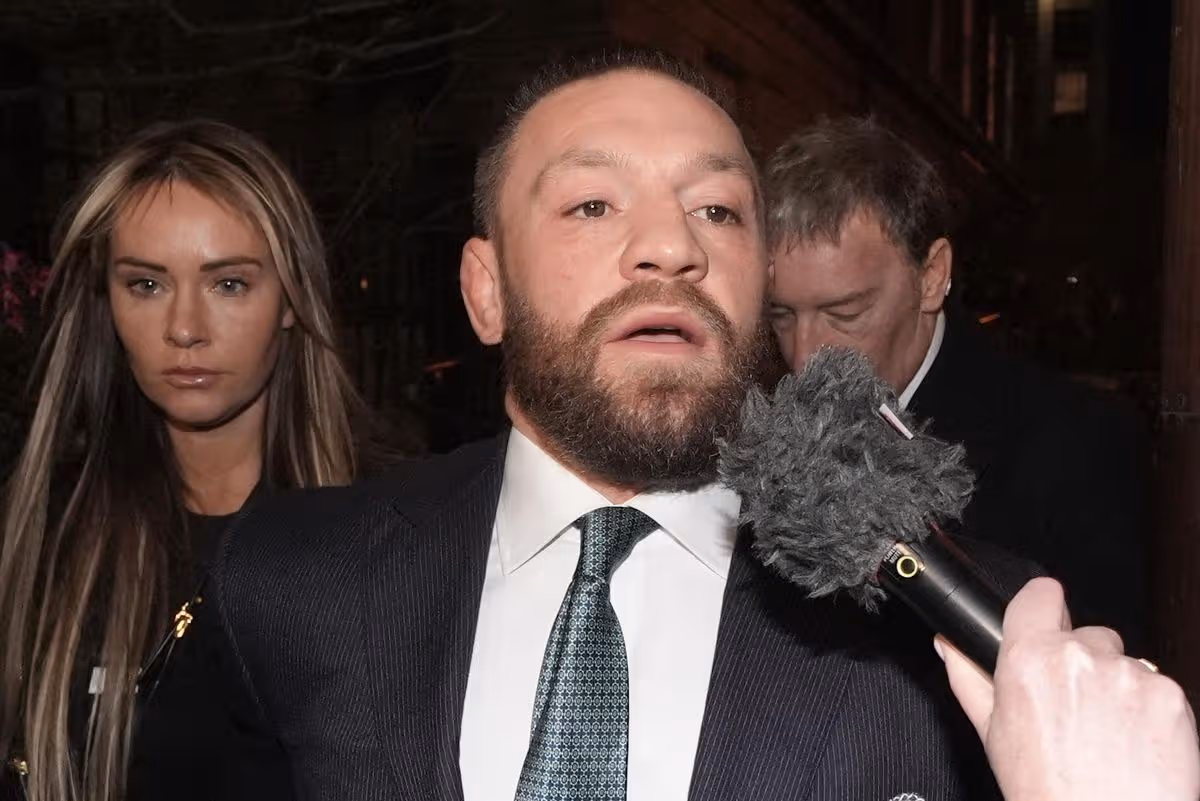 Conor McGregor and partner Dee Devlin leave the High Court in November