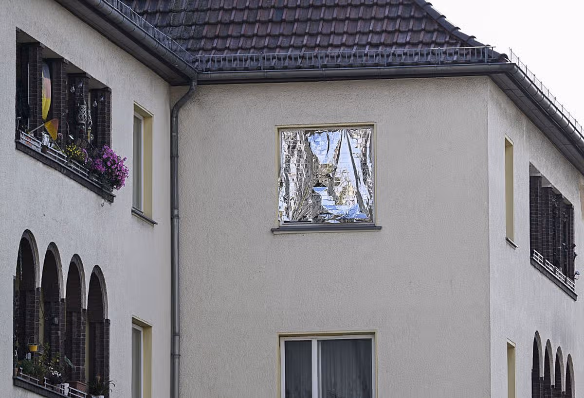 A view of a window covered with aluminum foil by a homeowner to protect against extreme heat during hot summer weather in Berlin, Germany on June 28, 2026