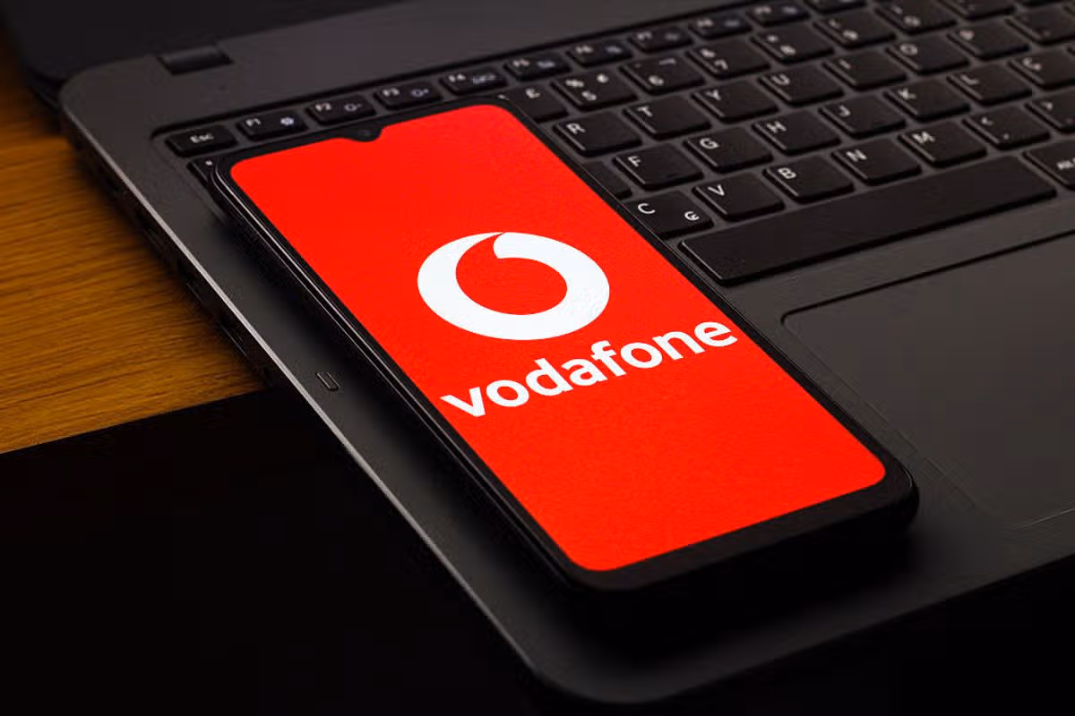 In this photo illustration, the Vodafone Group Plc logo is seen displayed on a smartphone screen