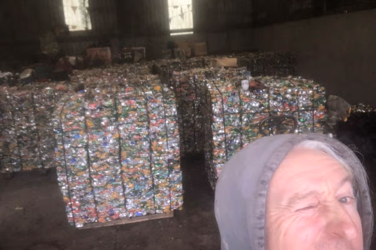 John Crossan with bales of aluminium cans at his premises in Longford