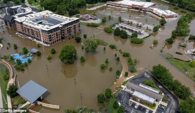 Five people have been found dead with more missing as unceasing rain causes devastating floods across Indiana. Pictured is submerged Noblesville