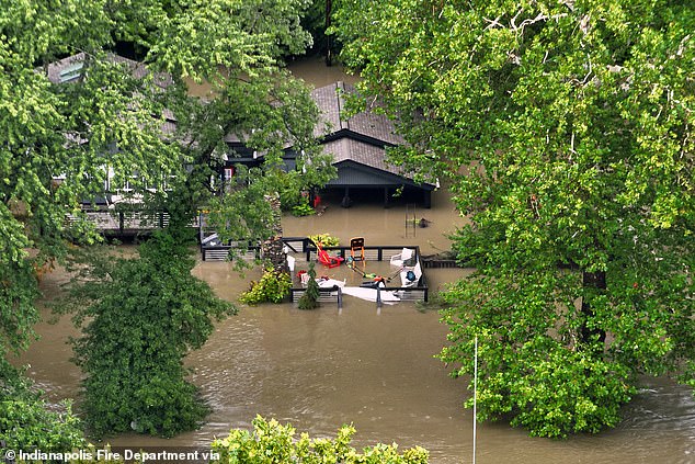 Homes were almost entirely submerged in parts of northern Indianapolis
