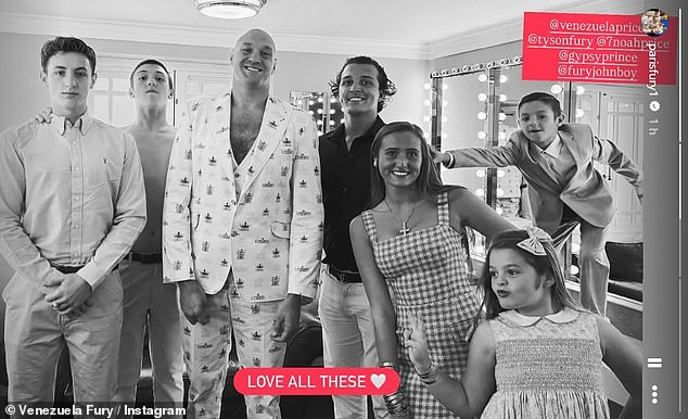 The couple posed for a group shot with her parents Paris and Tyson, her siblings Valencia , eight, Prince John James, 14, Prince Adonis, seven, and cousin Johnboy, 16