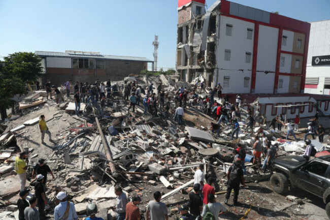 residents-and-rescue-workers-search-through-the-rubble-of-a-collapsed-building-after-an-earthquake-struck-cali-colombia-monday-aug-10-2026-ap-photosantiago-saldarriaga