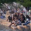 People spend time at Washington Square Park during hot weather in New York City on Monday.